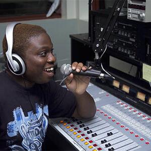 MCC student at console in WMCC, The Pulse, radio station